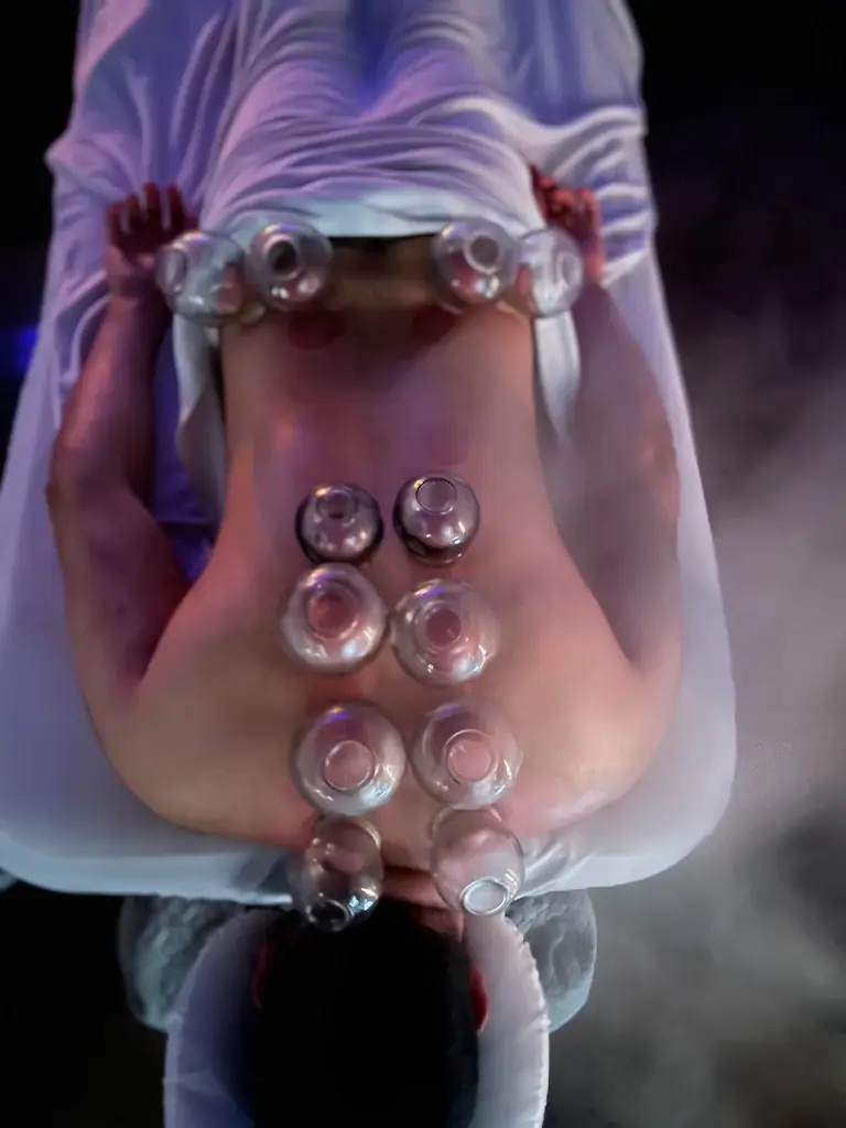 Cupping and deep tissue decompression work along a client's back at the Pre Bodyworks studio